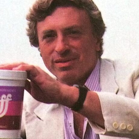 Larry Cohen holding a tub of stuff from his movie, The Stuff.