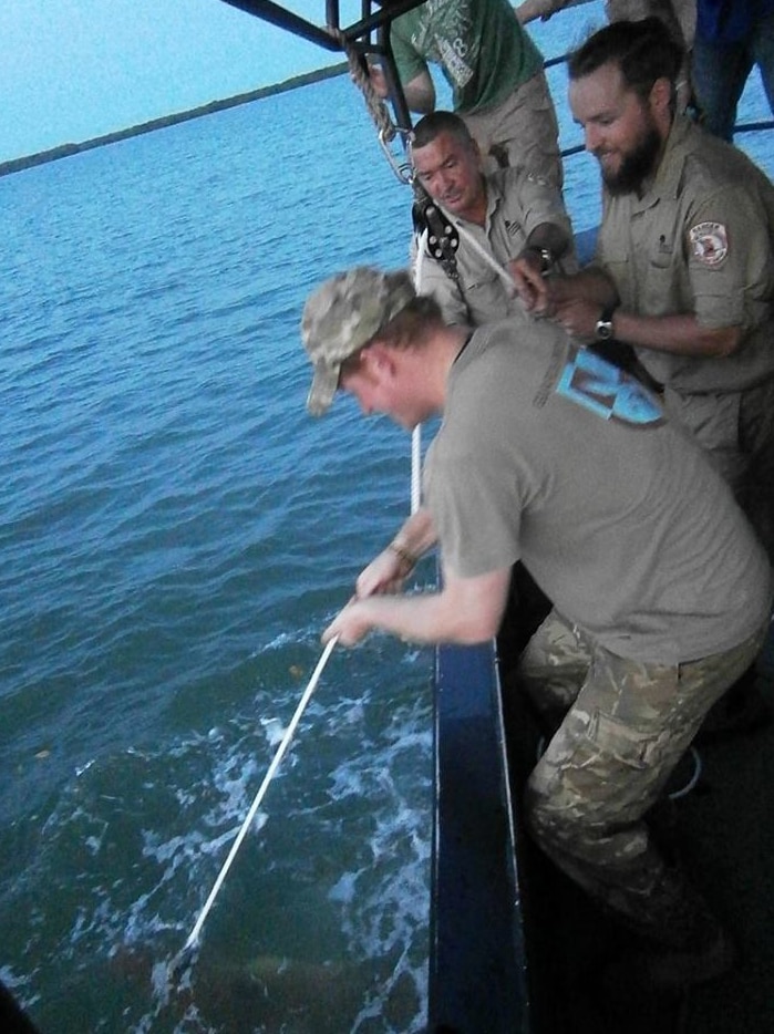 Prince Harry catches a croc