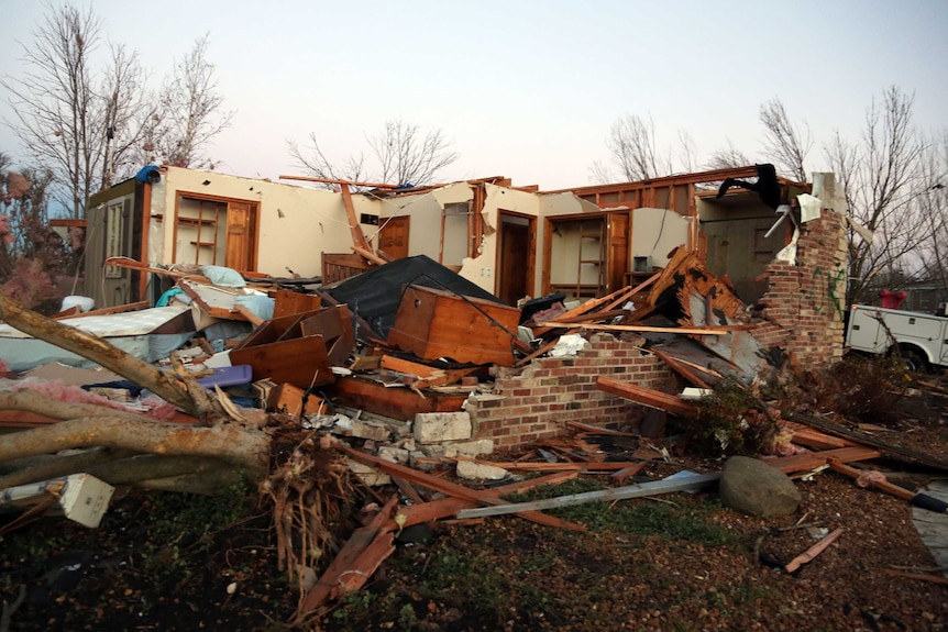 A home sits in ruin after a tornado