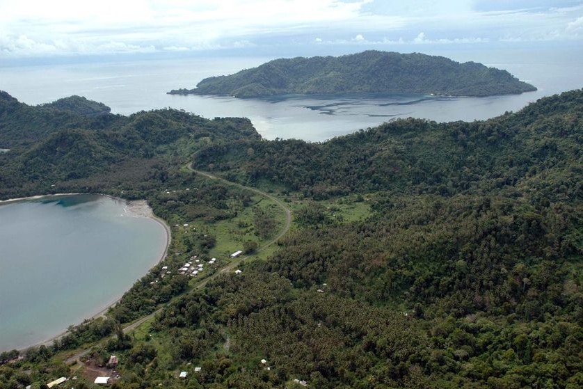 An aerial photo of a tropic landscape and ocean