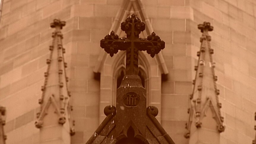 Stone work and a cross on a Catholic Church