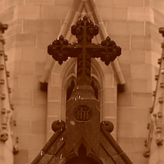 Stone work and a cross on a Catholic Church