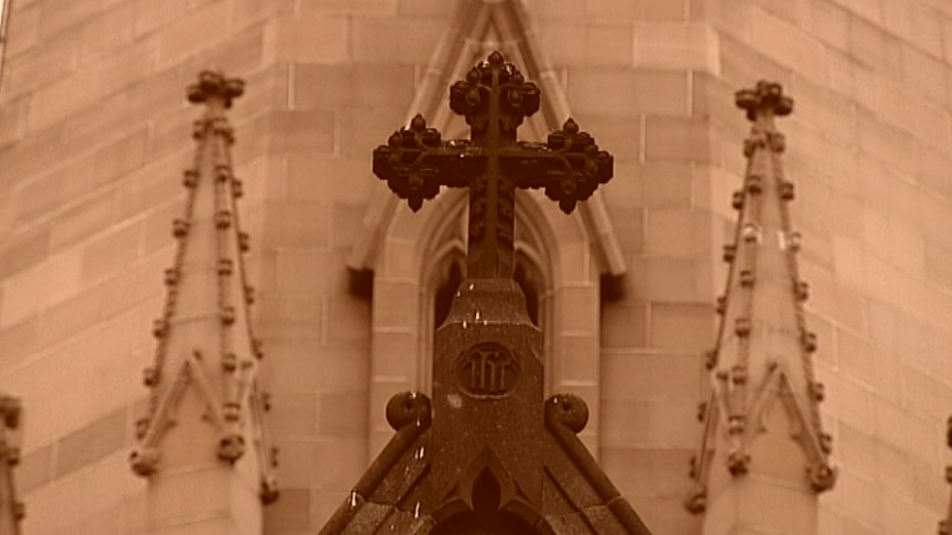 Stone work and a cross on a Catholic Church