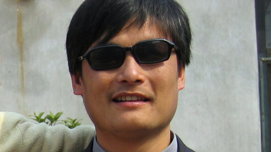 Blind activist Chen Guangcheng outside a house in Dondshigu village, north-east China.