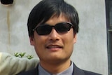 Blind activist Chen Guangcheng outside a house in Dondshigu village, north-east China.