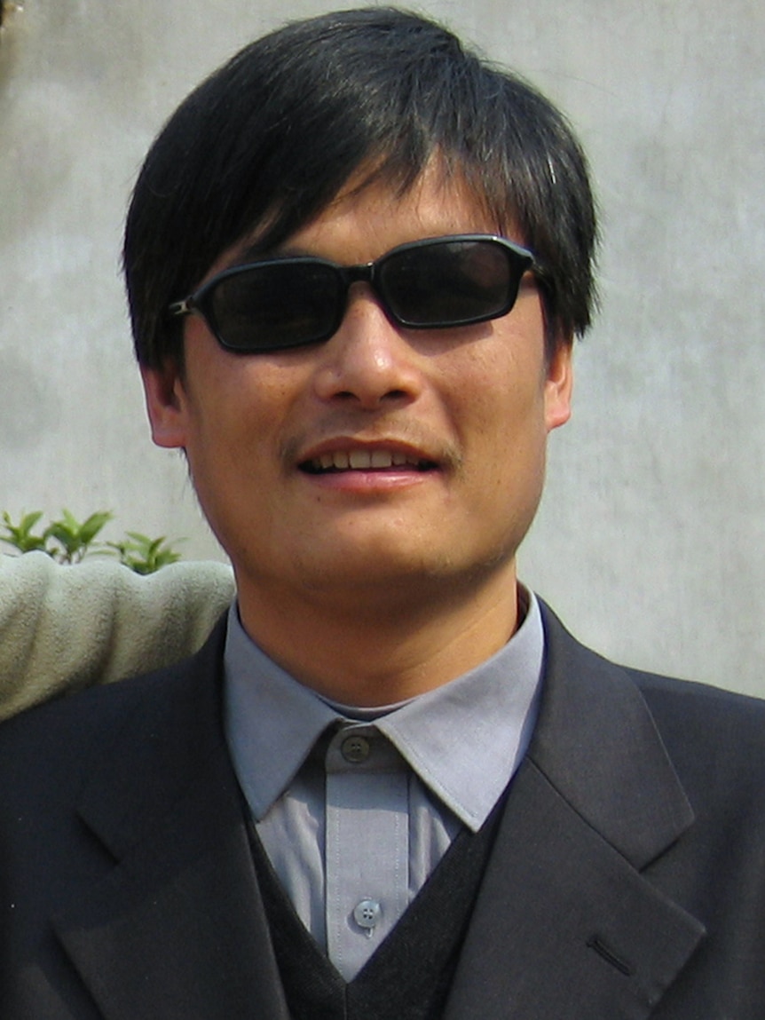 Blind activist Chen Guangcheng outside a house in Dondshigu village, north-east China.