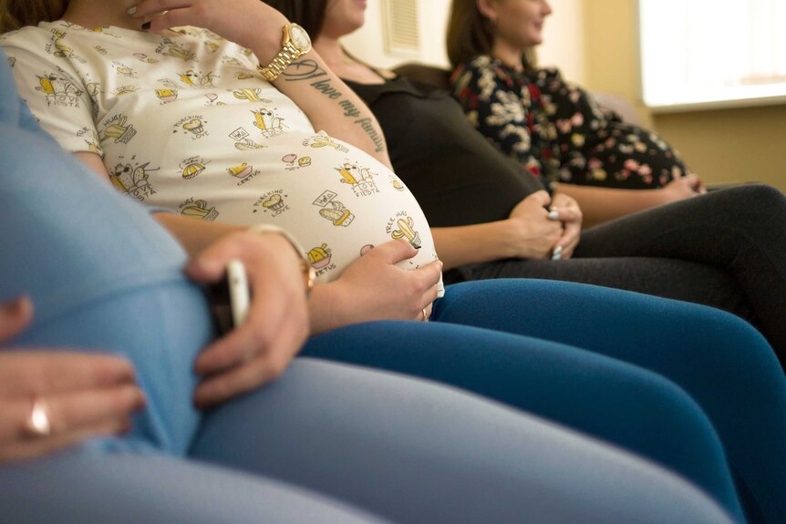Pregnant women wait