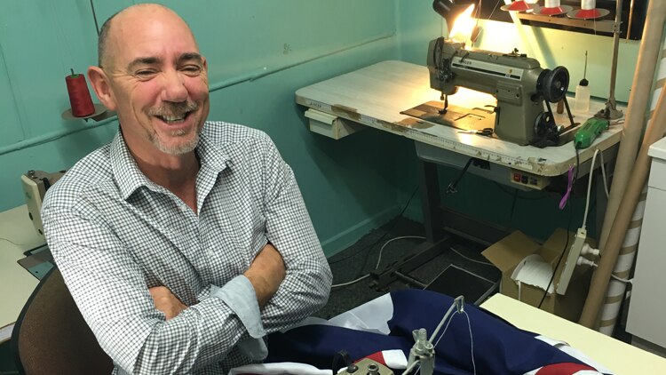 Gold Coast flag-maker Brad Palmer at his sewing machines