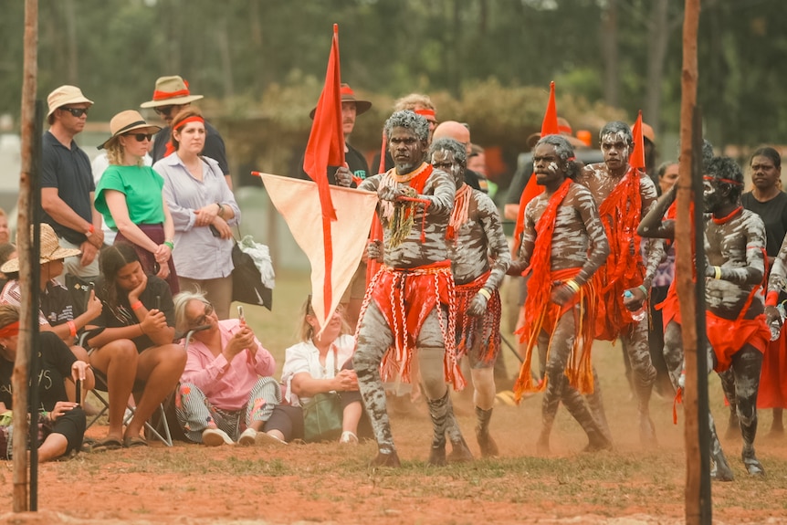 Indigenous dancers from the red flag clan perform.