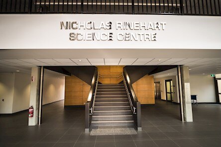 A building foyer with a sign reading 'Nicholas Rinehart Science Centre'.