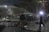 A policeman stands guard at the scene after a blast in Lahore.