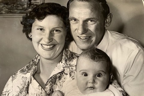 A photo from 1958 of parents Gwen and Les Schumer holding their baby Wendy