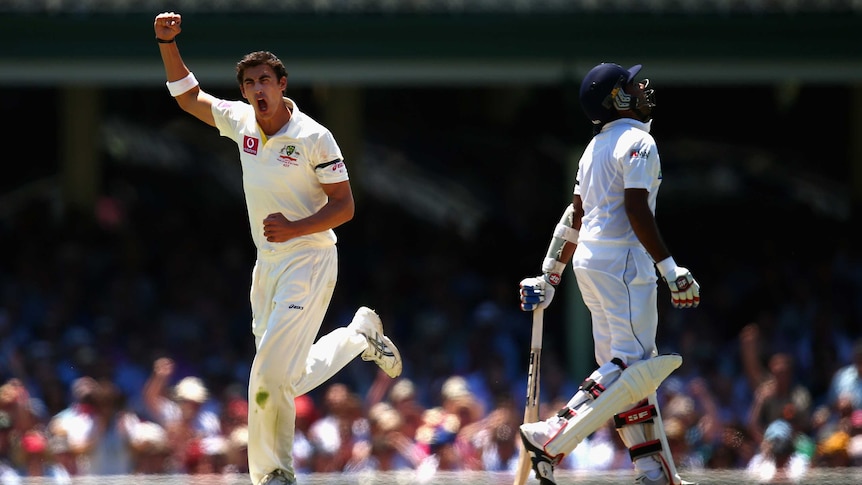 Crucial wicket ... Mitchell Starc celebrates Mahela Jayawardene's dismissal.