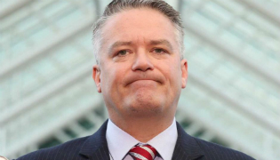 Finance Minister Mathias Cormann grimaces during an interview the day before the 2018 federal budget.