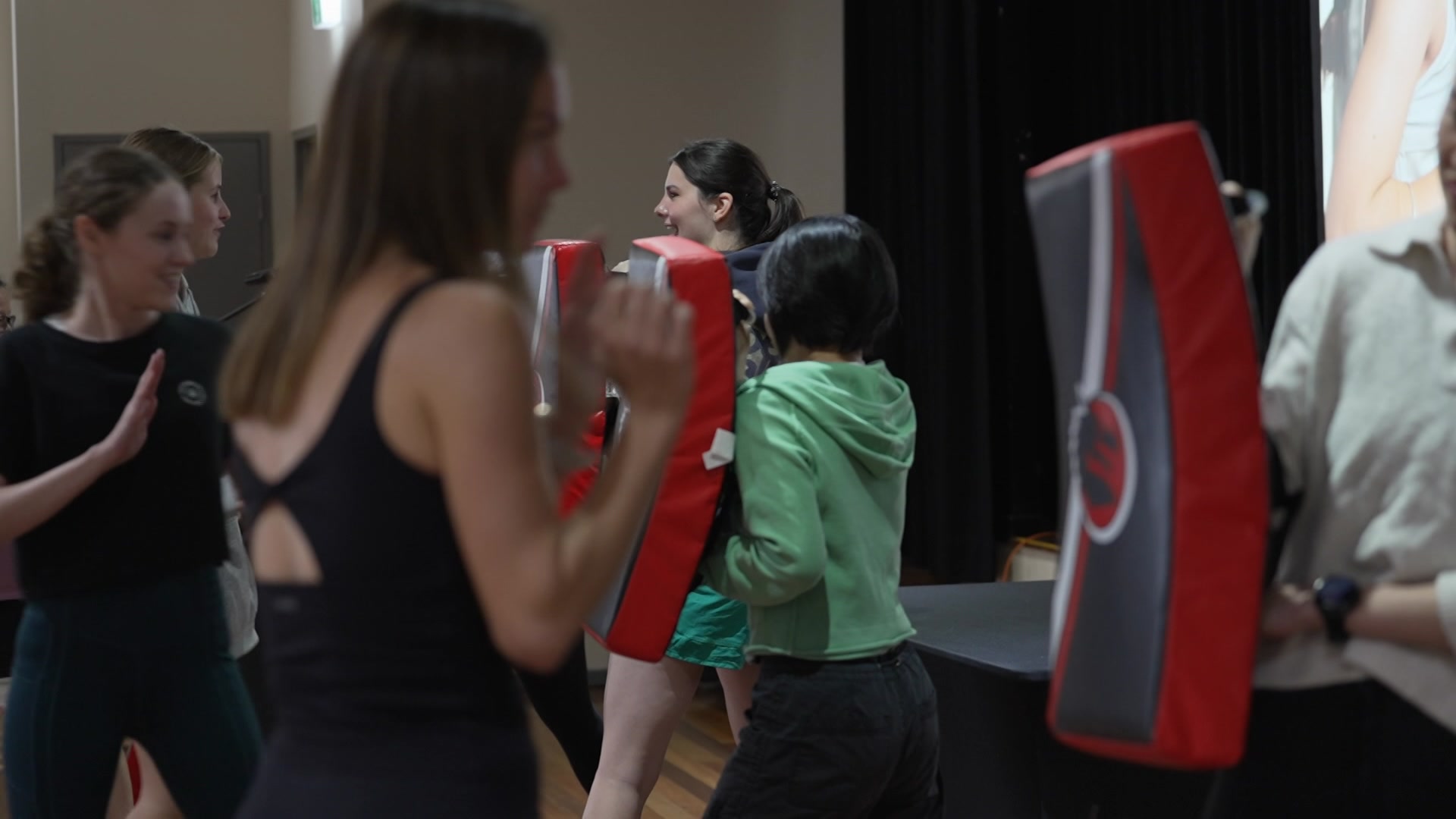 women taking part in a self defence course