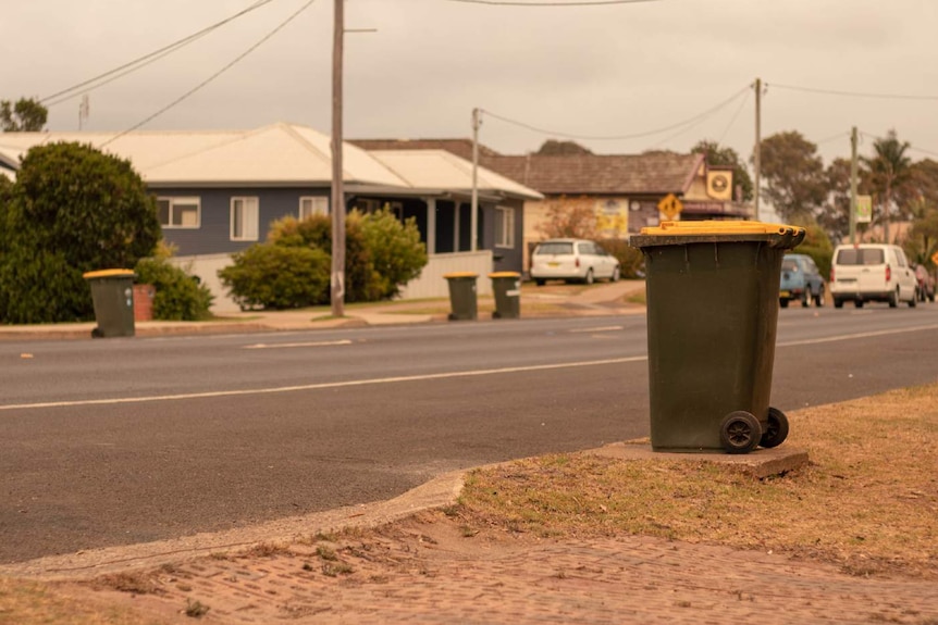 Yellow lid bins on a street