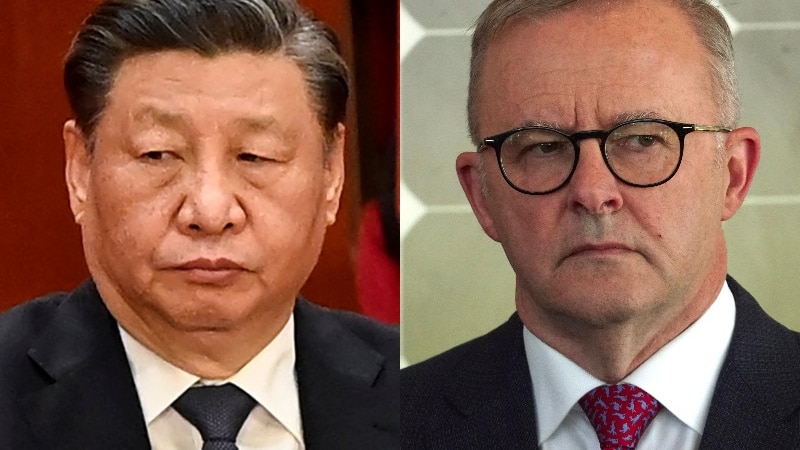 A close up of Xi Jinping and Anthony Albanese looking concerned.