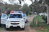 Police at the scene where three bodies were found at Hillier