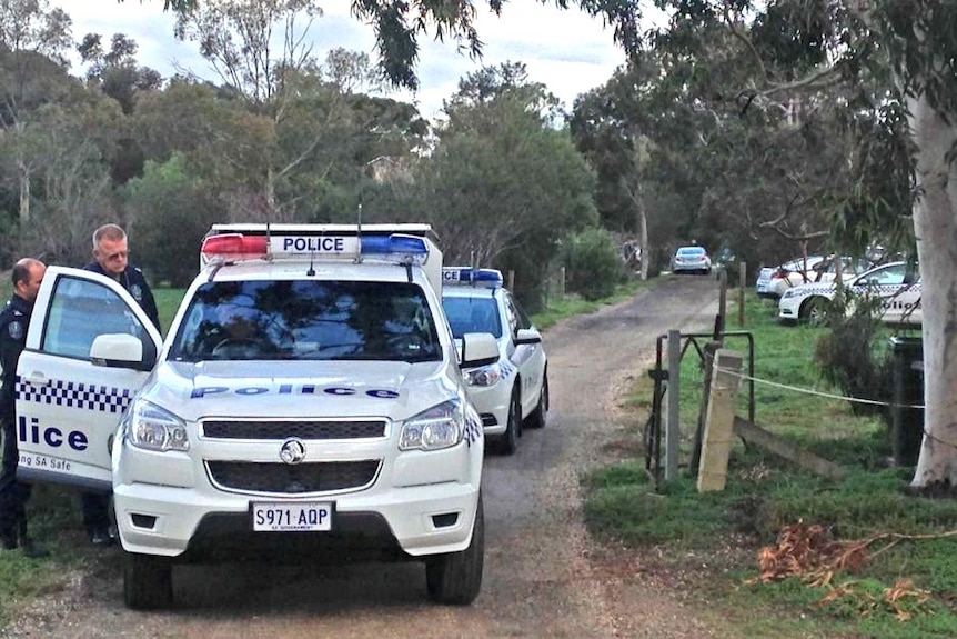 Police at the scene where three bodies were found at Hillier