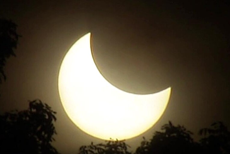 The solar eclipse begins to occur over northern Australia.