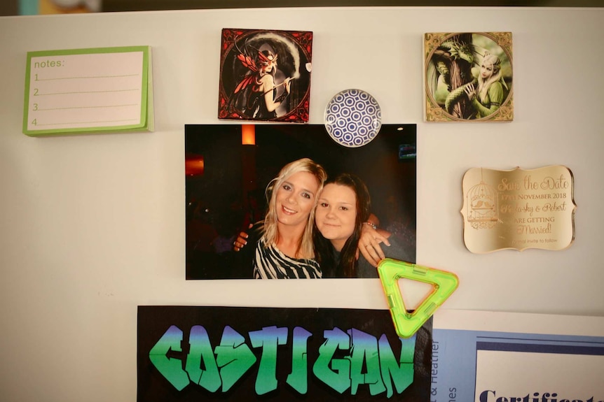 A photo of Tara Costigan and her sister Rikki on their aunt, Maria Costigan's fridge.