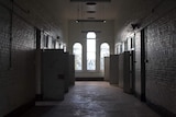 The corridor and cell doors along the top floor of Z Ward.
