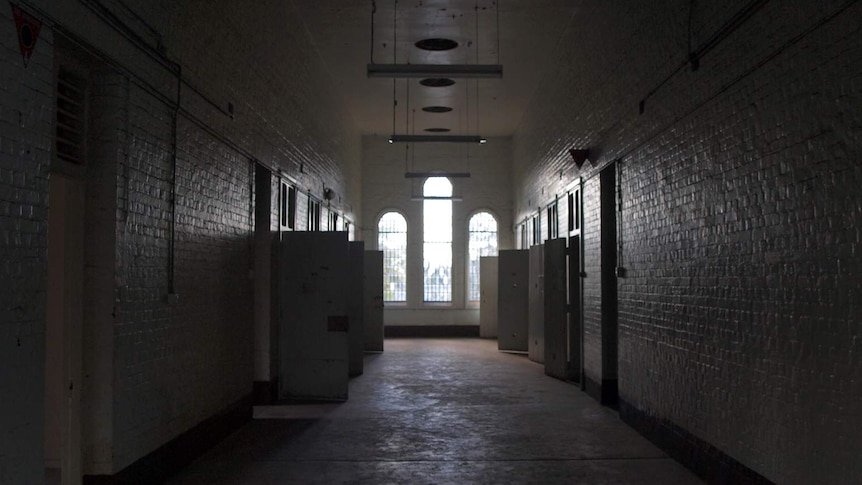 The corridor and cell doors along the top floor of Z Ward.