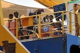 Sri Lankan asylum seekers look out from the rear deck
