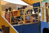 Sri Lankan asylum seekers look out from the rear deck