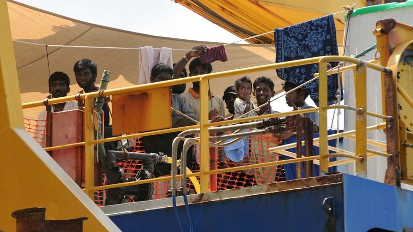 Sri Lankan asylum seekers look out from the rear deck