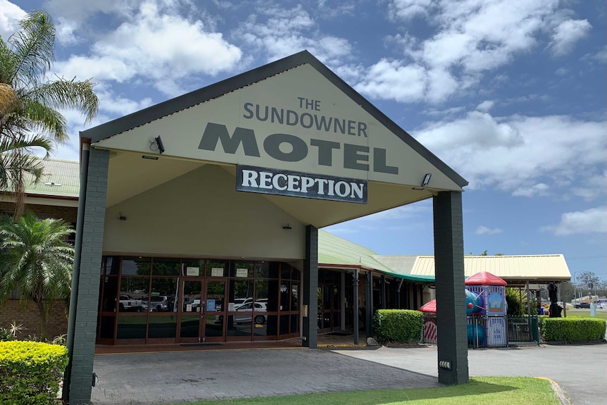 A pub that has the sign sundowner motel reception