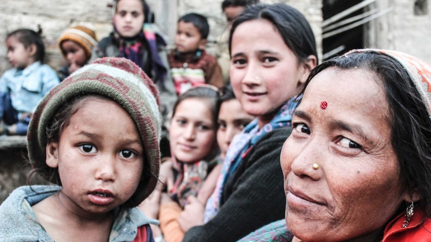 A child and a women from the community of Bemni in the Himalayas sit within other