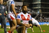 rugby league player kneels