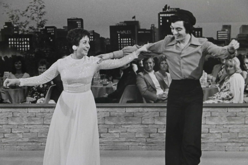 Anne Wills dancing with a young man.