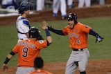 Houston Astros' George Springer (4) reacts to his home run against LA in World Series game seven.