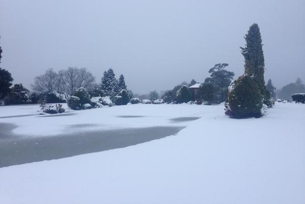 Snow covers a golf course in Orange