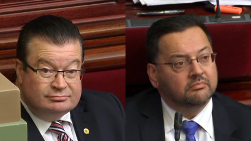 Liberal MPs Bernie Finn and Craig Ondarchie in Parliament.