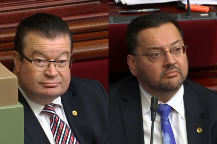 Liberal MPs Bernie Finn and Craig Ondarchie in Parliament.