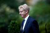 Jo Johnson walks outside Downing Street, London