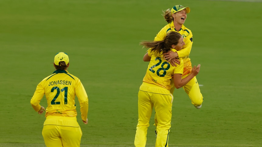 Australia cricketers Darcie Brown and Meg Lanning hug to celebrate a wicket in the Women's Ashes ODI against England.
