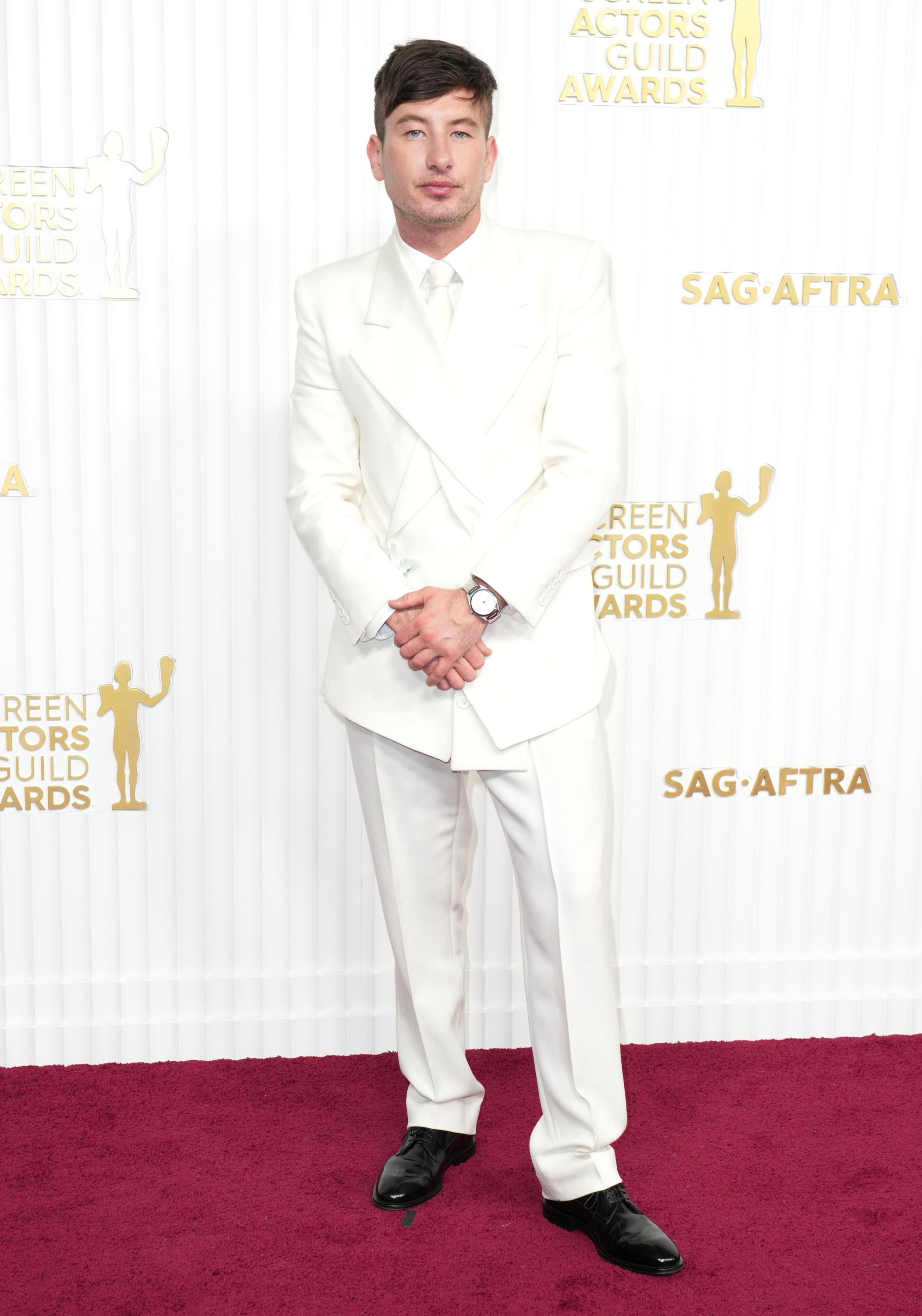 Barry Keoghan wearing a white suit with a white shirt underneath