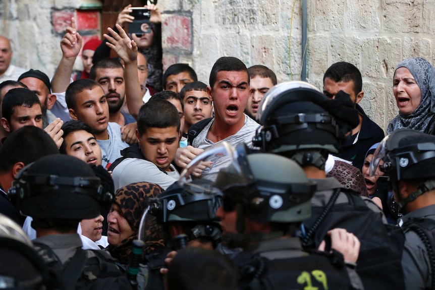Israeli security forces block a road leading to the Al-Aqsa mosque compound in Jerusalem's Old City