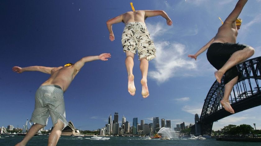 A group of children jump into Sydney Harbour during the Australia Day celebrations in Sydney on January 26, 2008.