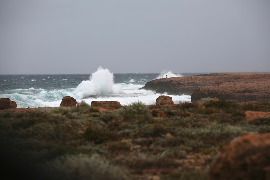 A rugged stormy cliff face.