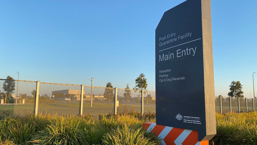 A sign outside the Post Entry Quarantine Facility in Mickleham on a golden sunny morning.