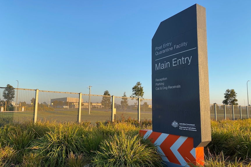 A sign outside the Post Entry Quarantine Facility in Mickleham on a golden sunny morning.