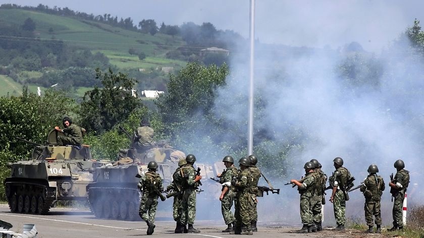 Russian troops secure the bridge on the Enguri river on the border