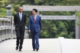 Barack Obama walking with Japanese Prime Minister Shinzo Abe.
