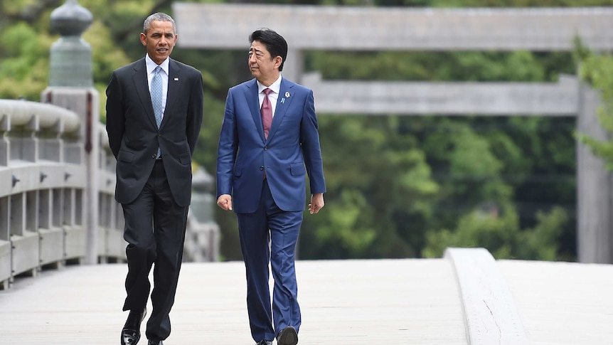 Barack Obama walking with Japanese Prime Minister Shinzo Abe.