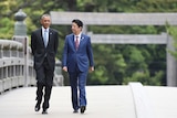 Barack Obama walking with Japanese Prime Minister Shinzo Abe.